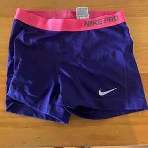 purple nike pros with pink band